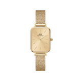 Gold rectangular women’s watch with minimalist dial and pressed mesh strap, featuring a sleek, contemporary design.