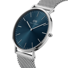 Classic Mesh Arctic Silver watch with a deep blue sunray dial, minimalist silver hour markers, and a polished stainless steel mesh strap.