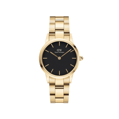 Gold women’s watch with black dial, minimalist gold hour markers, and polished link bracelet by Daniel Wellington.