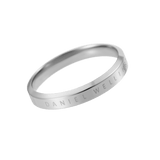 Slender silver ring crafted from polished stainless steel with subtle Daniel Wellington engraving along the band.