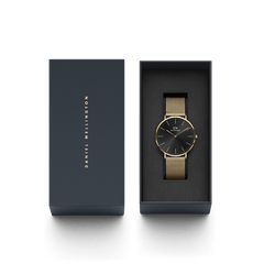 Classic Mesh Onyx Gold wristwatch with a black dial and gold mesh strap, elegantly presented in a dark Daniel Wellington gift box.