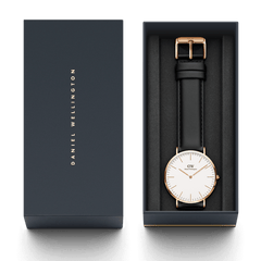 Daniel Wellington Classic Sheffield Rose Gold watch with black leather strap, presented in a sleek gift box.