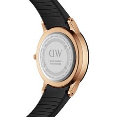 Back view of Iconic Motion Rose Gold women’s watch with engraved case, black rubber strap, and rose gold stainless steel.