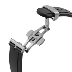 Close-up of the Daniel Wellington Iconic Motion watch’s black FKM rubber strap with a stainless steel deployment clasp.