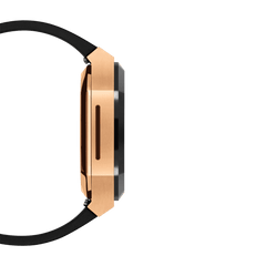 Side profile of the Switch Rose Gold Apple Watch case showing the brushed rose gold stainless steel frame, black bezel, and slim ergonomic design with a black rubber strap.