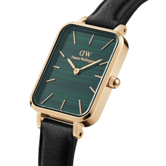 Quadro Pressed Sheffield Gold women’s watch with emerald green rectangular dial, gold case, and black leather strap.
