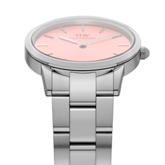 Detail view of the Iconic Link Blush watch highlighting the brushed stainless steel link bracelet and pastel pink minimalist dial.