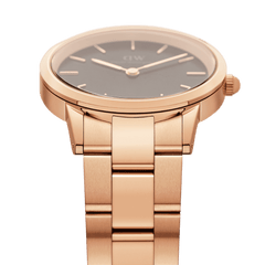 Daniel Wellington Iconic Link Rose Gold watch featuring a black dial and polished rose gold stainless steel link bracelet, side view.