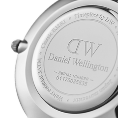 Engraved caseback of the Daniel Wellington Petite Bondi Black Silver watch, featuring the brand logo, water resistance rating, and unique serial number.
