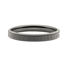 Minimalist graphite band ring in polished stainless steel with Daniel Wellington engraved along the outer edge.