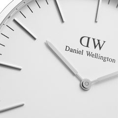 Detail of Classic Sheffield Silver watch face with minimalist white dial, silver hands and Daniel Wellington branding.