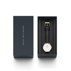 Petite Sheffield Gold women’s watch with black leather strap in Daniel Wellington gift box, minimalist gold detailing.