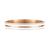 Satin white enamel and rose gold bangle with Daniel Wellington engraving, featuring a sleek, modern design and polished finish.
