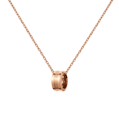 Rose gold necklace featuring a polished ring pendant with engraved detailing, suspended from a delicate adjustable chain.