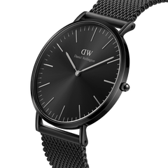 Classic Mesh Onyx Black watch with a sleek black sunray dial, minimalist hour markers, and a polished black stainless steel mesh bracelet.