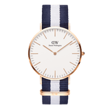 Daniel Wellington Classic Glasgow Rose Gold watch featuring a minimalist eggshell white dial, slim rose gold case, and a navy and white striped NATO strap.