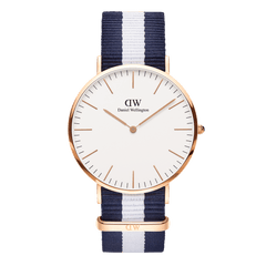 Daniel Wellington Classic Glasgow Rose Gold watch featuring a minimalist eggshell white dial, slim rose gold case, and a navy and white striped NATO strap.