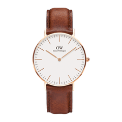 Rose gold Daniel Wellington Classic St Mawes watch with white minimalist dial and brown genuine leather strap.