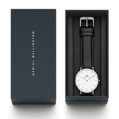 Classic Sheffield Silver watch with black leather strap in Daniel Wellington gift box, minimalist white dial, perfect for gifting.