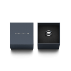 Elan Triad Ring Silver with a polished three-band design, elegantly presented in a dark Daniel Wellington gift box.