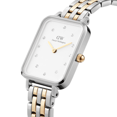 Quadro Lumine 5-link two-tone women’s watch with rectangular case, crystal hour markers, and gold-silver stainless steel strap.