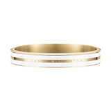 Gold bangle bracelet with a polished finish, white enamel inlay, and engraved Daniel Wellington logo, showcasing a modern yet timeless design.