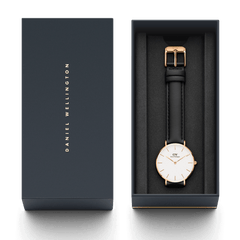 Petite Sheffield Rose Gold watch with a black leather strap presented in an elegant Daniel Wellington gift box.
