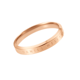 Slim rose gold ring with a polished finish and subtle Daniel Wellington engraving along the outer edge.