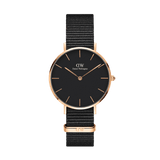 Daniel Wellington Petite Cornwall Rose Gold women’s watch with black dial, rose gold case, and black woven NATO strap.