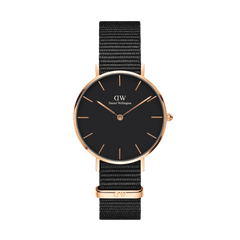 Daniel Wellington Petite Cornwall Rose Gold women’s watch with black dial, rose gold case, and black woven NATO strap.