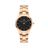 Rose gold Daniel Wellington Iconic Link watch with black dial and polished stainless steel link bracelet, minimalist design.
