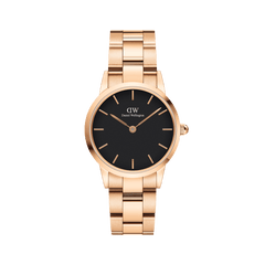 Rose gold Daniel Wellington Iconic Link watch with black dial and polished stainless steel link bracelet, minimalist design.