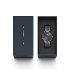 Classic Mesh Graphite watch with a graphite sunray dial and mesh strap, elegantly presented in Daniel Wellington’s signature gift box.