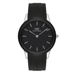 Daniel Wellington Iconic Motion watch featuring a black dial, minimalist silver hour markers, and a black FKM rubber strap with subtle branding, set in a polished 40mm stainless steel case.