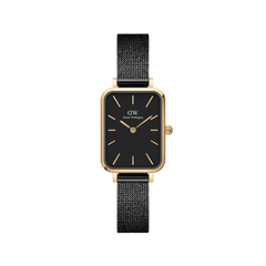 Rectangular gold women’s watch with black dial, minimalist gold markers, and black mesh strap by Daniel Wellington.