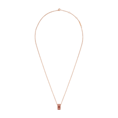 Rose gold chain necklace with an adjustable length, featuring a cherry blush enamel barrel pendant for a modern classic look.