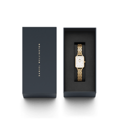 Quadro 5-Link Evergold women’s gold watch with rectangular dial, presented in a sleek Daniel Wellington gift box.