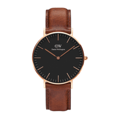 Daniel Wellington Classic St Mawes watch with a black minimalist dial, rose gold case, and brown genuine leather strap.