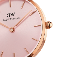 Close-up of the Petite Melrose Light Pink watch showing its soft pink dial, minimalist gold hour markers, and rose gold case detailing.