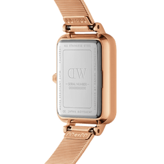 Close-up of the Quadro Lumine Pressed Piano White MoP Rose Gold watch showing the engraved stainless steel case back, rose gold rectangular frame, and pressed piano link strap.