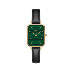 Daniel Wellington Quadro Pressed Sheffield Gold women’s watch with emerald green dial, gold case, and black leather strap.