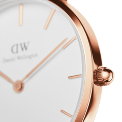 Detail of the Petite Dover Rose Gold watch highlighting the polished rose gold case, minimalist hour markers, and slim crown against the eggshell-white dial.