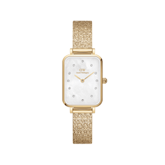 Rectangular gold women’s watch with white mother of pearl dial, crystal markers, and textured gold Pressed Piano strap.