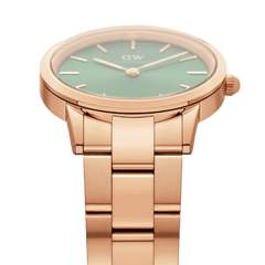 Close-up of the Iconic Link Emerald Green Rose Gold watch, highlighting the polished rose gold link bracelet and the sleek emerald green dial.