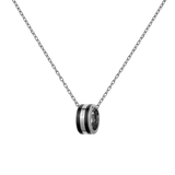 Silver necklace featuring a delicate chain and a polished ring pendant with black enamel detailing.