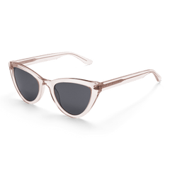 Lynx Bio-Acetate sunglasses featuring a transparent pastel pink cat eye frame and bold black lenses, shown from an angled view highlighting their modern, feminine design.