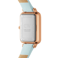 Close-up of the Quadro Bluebell Rose Gold watch showing the engraved stainless steel case back and pastel blue Italian leather strap.