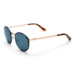 Daniel Wellington Arch Steel Blue Rose Gold sunglasses with round blue lenses, a slim rose gold frame, and tortoiseshell acetate tips.