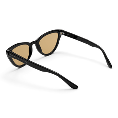Lynx Bio-Acetate Black / Yellow sunglasses with cat eye frames, yellow nylon lenses, and Daniel Wellington branding on the sleek black arms, shown from a rear angle.