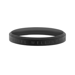 Unisex matte black stainless steel ring featuring subtle engraved Daniel Wellington branding and a slim, minimalist profile.